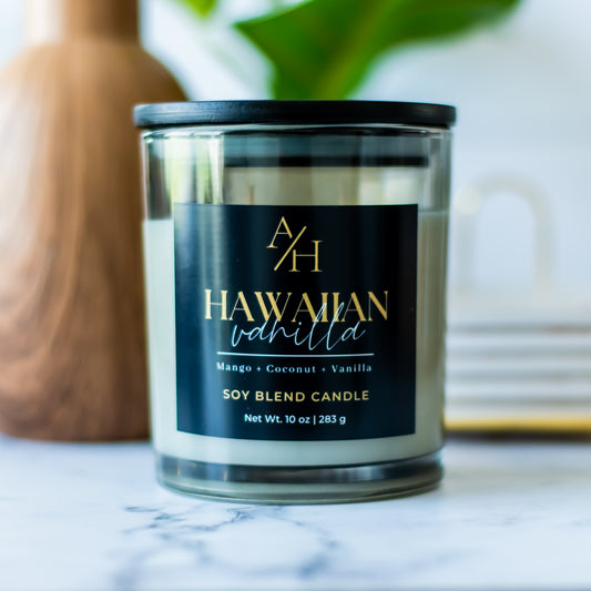 Our Hawaiian Vanilla Candle is a tropical oasis featuring notes of Mango, Coconut, Lotus Flower, Heliotrope, and Vanilla.

This vibrant yet soothing fragrance fills your home with a dreamy, island-inspired ambiance perfect for relaxation and everyday indulgence.