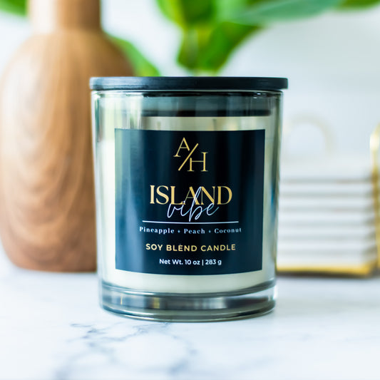 Island Vibe is a tropical paradise featuring notes of Orange, Pineapple, Peach, Mango, and Coconut Milk.&nbsp;

This candle fills your home with a bright, uplifting aroma that’s perfect for relaxing, entertaining, or adding a touch of summer to any room.
